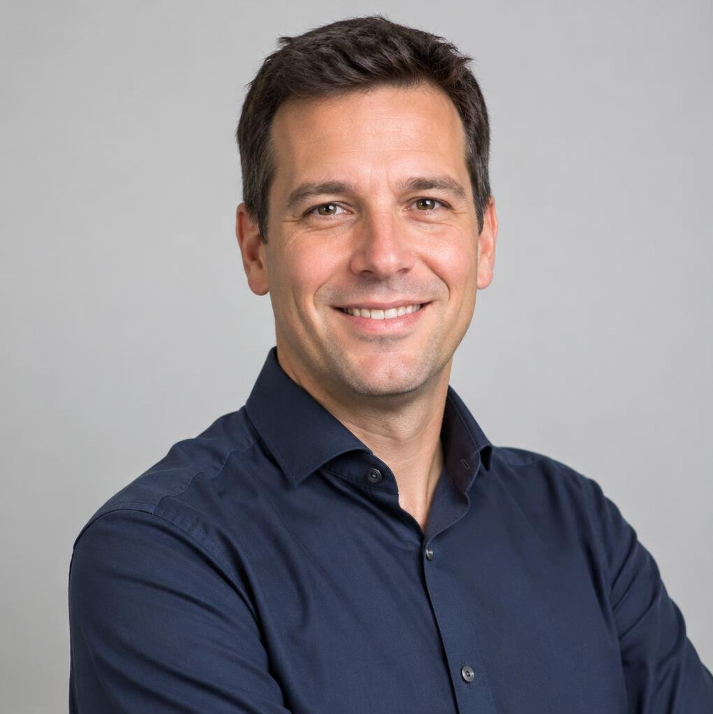 Studio portrait of a man in a shirt smiling