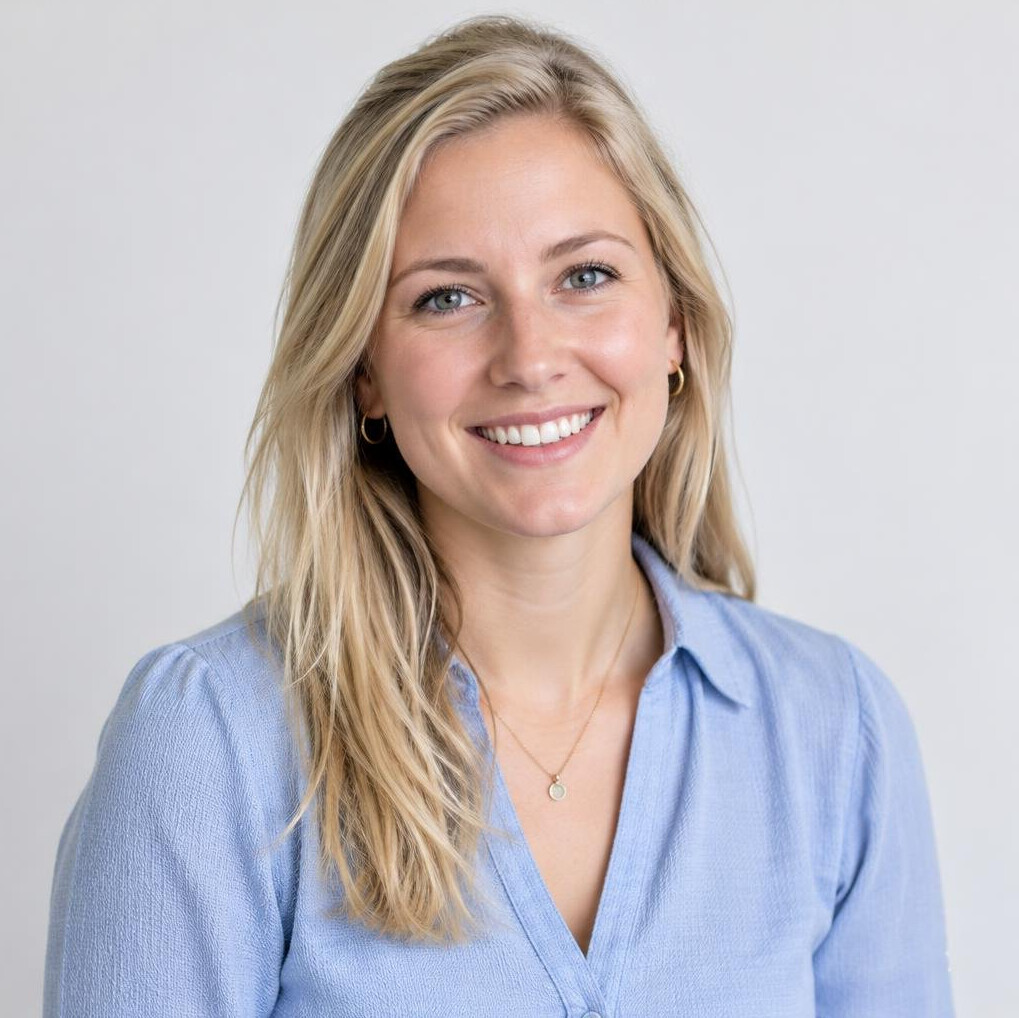 Portrait of a smiling young blonde woman in an office